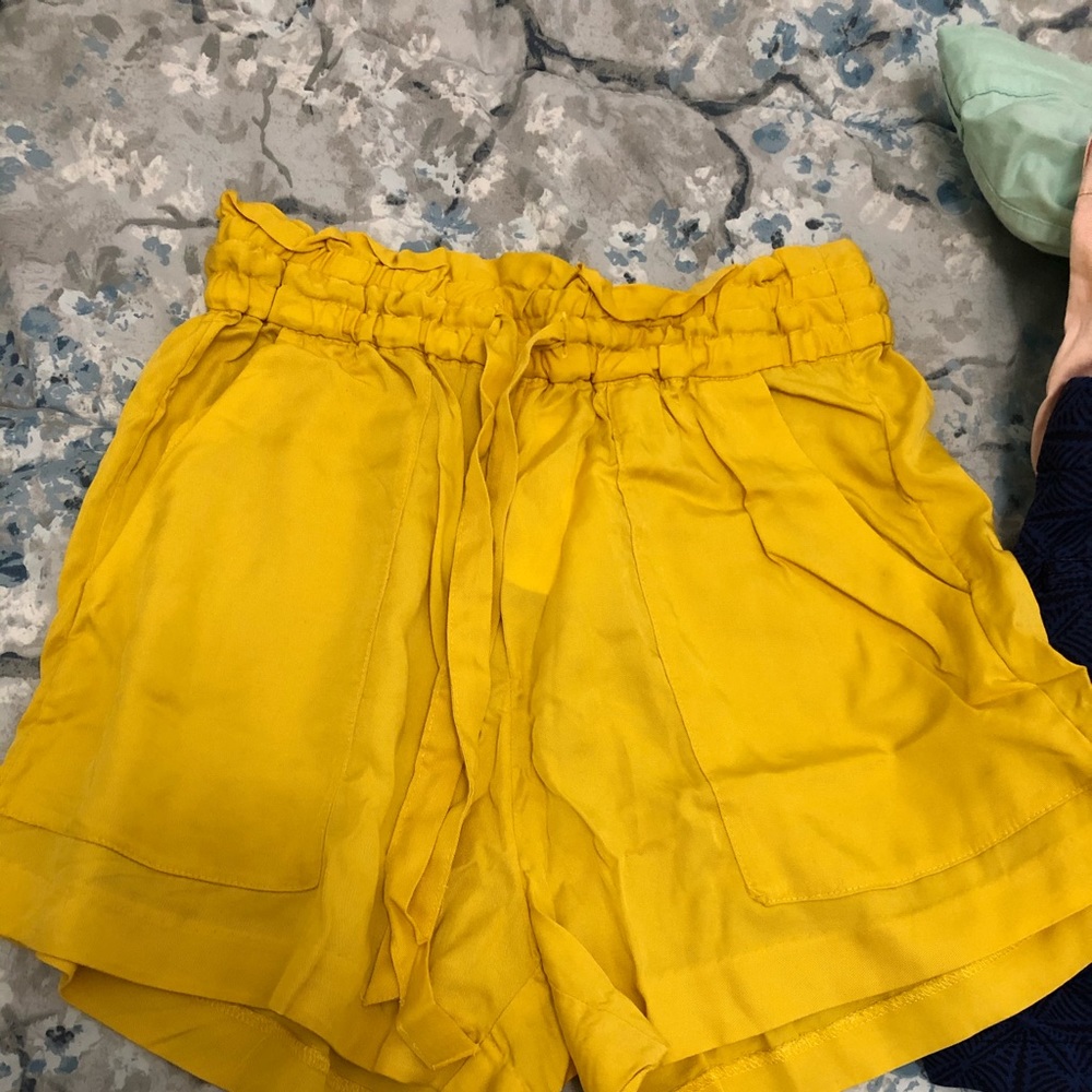 Yellow high waisted paper bag shorts